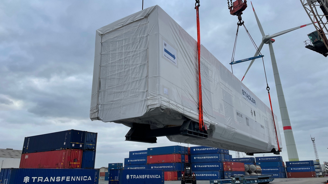 Stadler rail cars on extra-length roll trailers Stadler rail cars on extra-length roll trailers